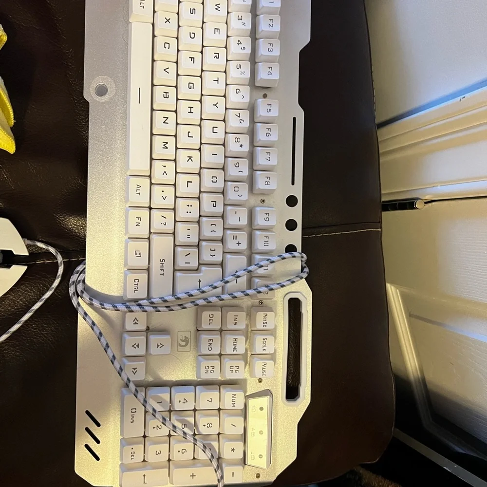 Gaming key board and headphones. Both hardly used.